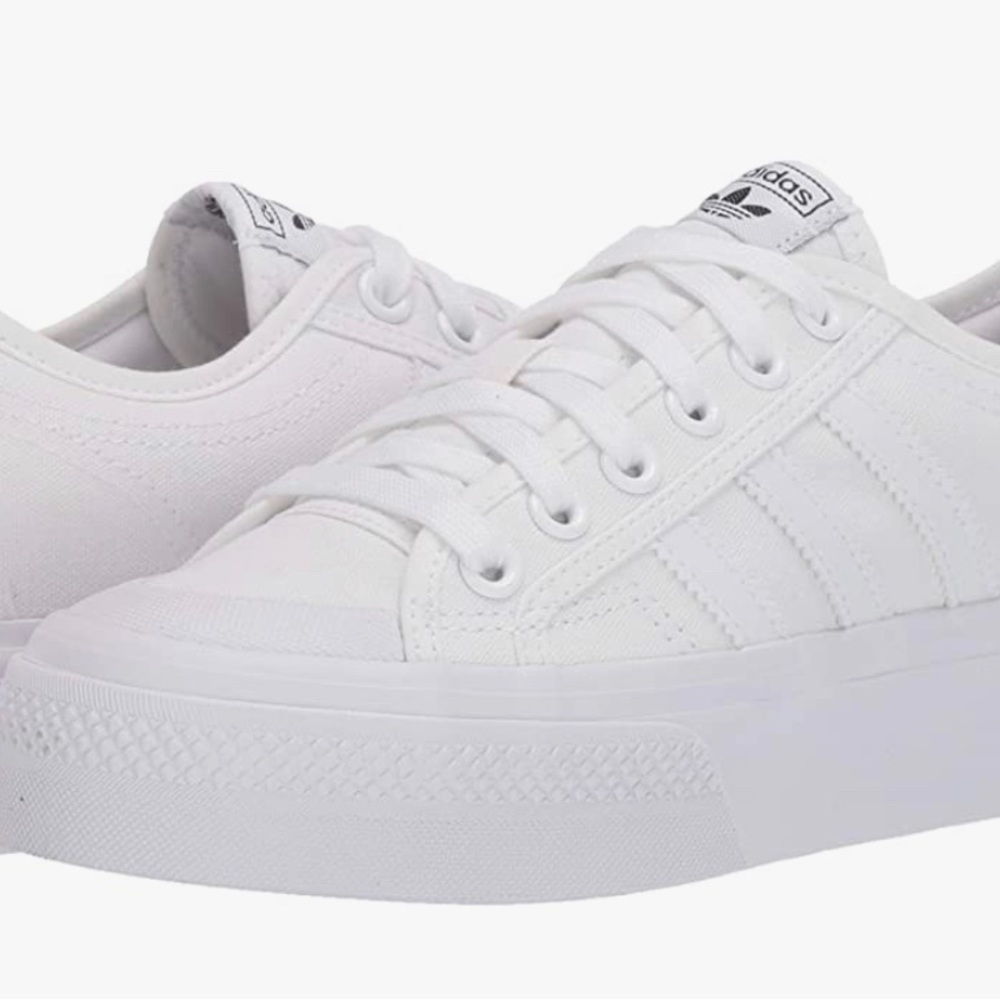 Women’s US size 10 Adidas Nizza platform tennis shoes. Worn once.
